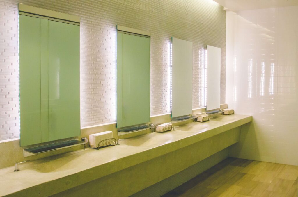 A clean and modern commercial restroom maintained by iCleaners' professional odour control services in Hamilton, Ontario.
